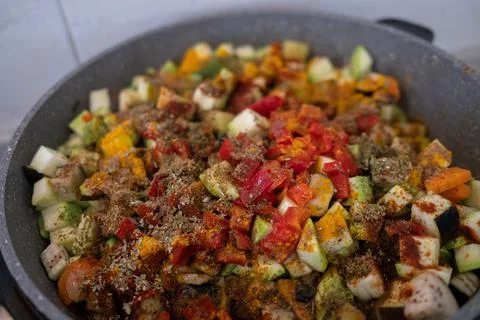 Assorted vegetables are fried in a pan. Colorful healthy food. Фото