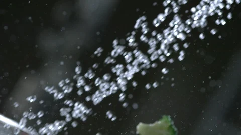 Assorted vegetables are washed in a colander under running water Stock Footage 113609391