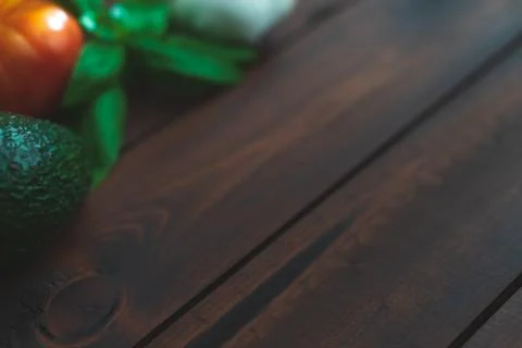 Assorted vegetables on brown table great for farm to table marketing. Stock Photos