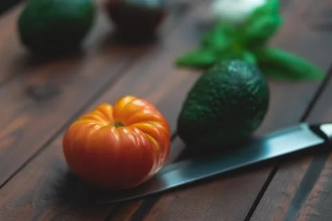 Assorted vegetables on brown table great for farm to table marketing. Stock Photos