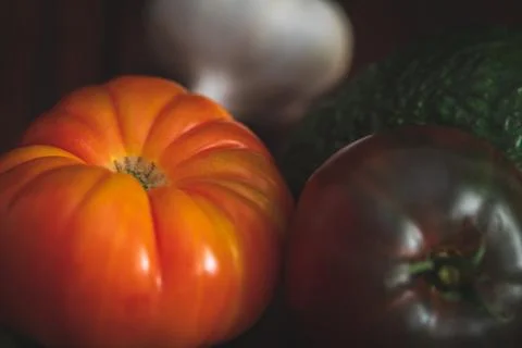 Assorted vegetables on brown table great for farm to table marketing. Stock Photos