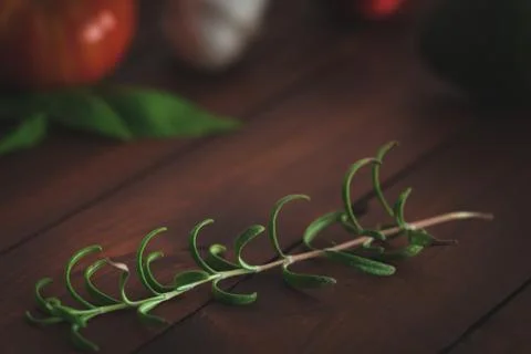 Assorted vegetables on brown table great for farm to table marketing. Stock Photos