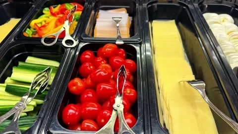 Assorted Vegetables, Cheeses, Sauces, and Fish on Buffet Table in Norway Stock-Footage 340254896