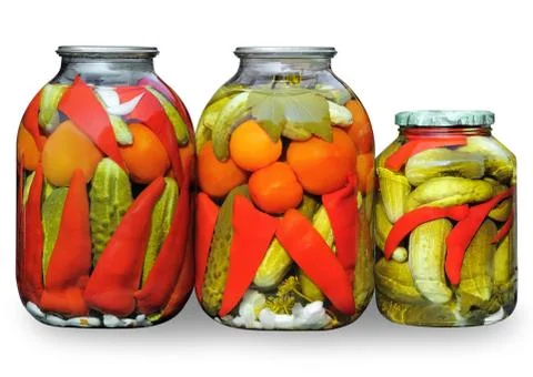 Assorted vegetables in glass jars Stock Photos