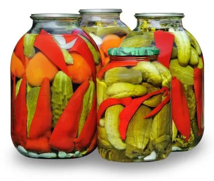 Assorted vegetables in glass jars Stock Photos