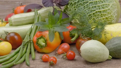 Assorted vegetables on a wooden background. Stockbeeldmateriaal 115691419