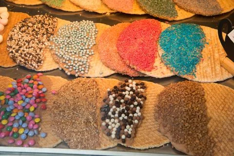 Assorted waffles with multicolored toppings Stock Photos