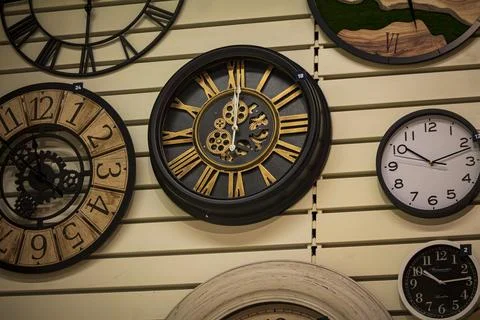 Assorted wall clocks on a store display Stock Photos