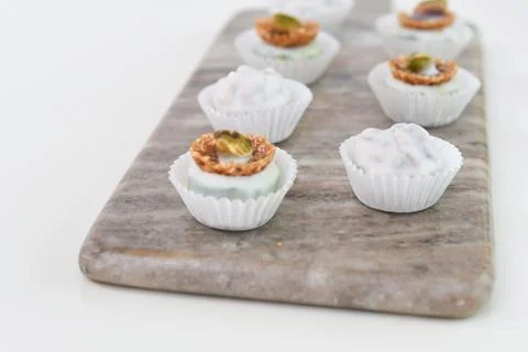 Assorted White Chocolate and Nut Truffles mini dessert isolated on Marble B.. Foto stock