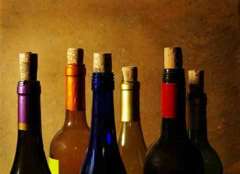 Assorted wine bottles with corks Stock Photos