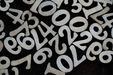 Assorted Wooden Numbers Background for Educational and Craft Projects Stock Photos