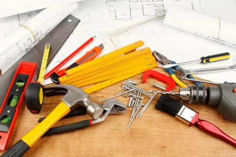 Assorted work tools and plans Stock Photos