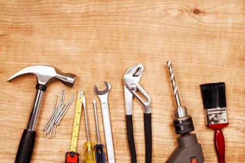 Assorted work tools on wood Stock Photos