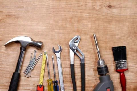 Assorted work tools on wood Stock Photos