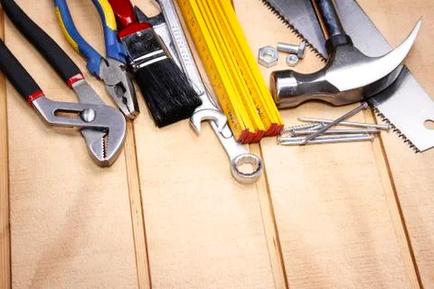 Assorted work tools on wood Stock Photos