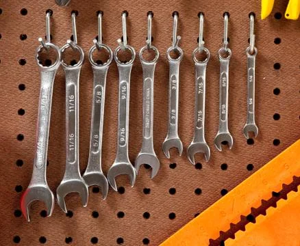 Assorted wrenches on a peg board Stock Photos