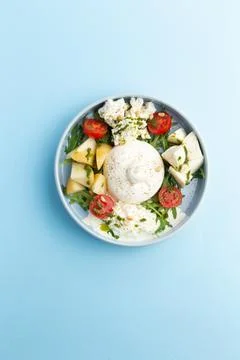 Assorted young cheeses. Ricotta, mozzarella, buratta, tomatoes. Stock Photos