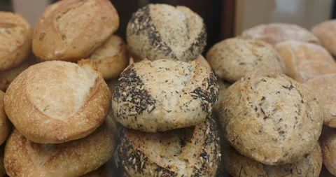 Assortment of baked bread in a bakery window display Stock Footage 148100732