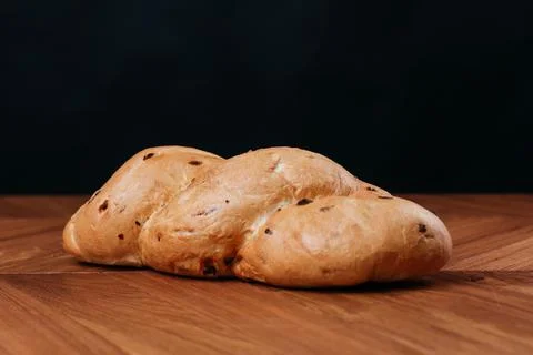Assortment of baked bread on table Foto stock