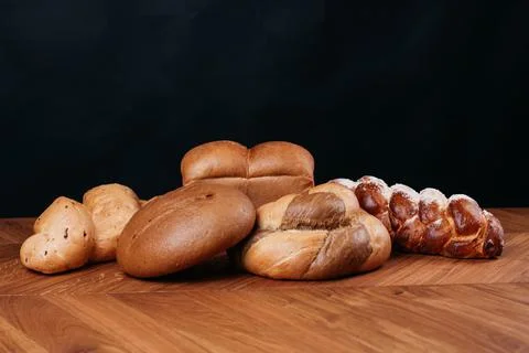 Assortment of baked bread on table Stock Photos
