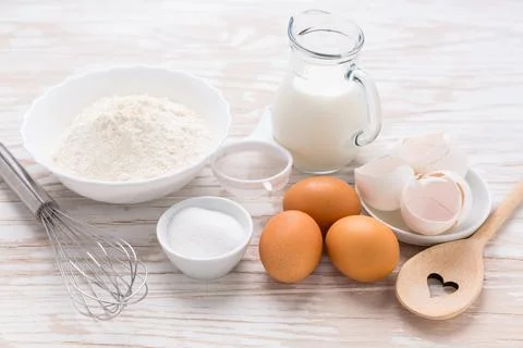 Assortment of basic baking ingredients for cake or pancakes on wooden background 스톡 사진