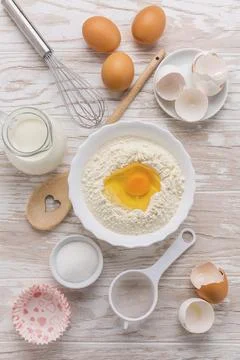 Assortment of basic baking ingredients for cake or pancakes on wooden background 스톡 사진