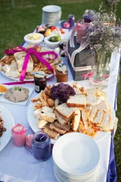 Assortment of bread and condiments on table at a wedding Stock Photos