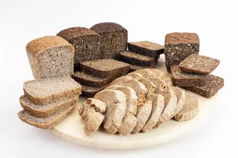 Assortment of bread on the kitchen table on a white isolated background Stock Photos
