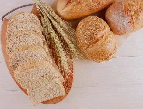 Assortment of breads on wooden table Stock Photos