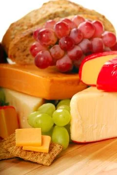 Assortment of cheese and fruit Stock Photos