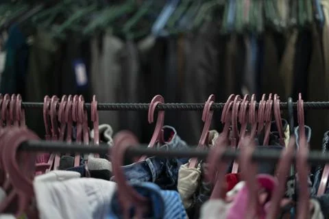 Assortment of clothes in the store Stock Photos