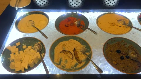 An assortment of condiments at a restaurant buffet. Different sauces. Stock Footage 266090162