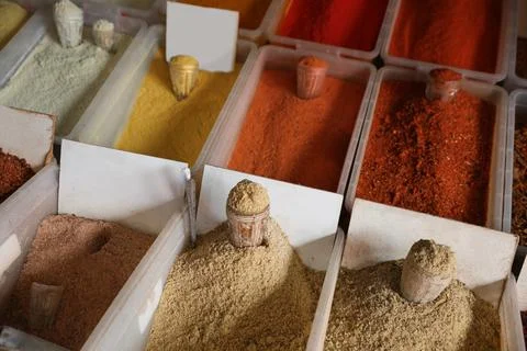 Assortment of different aromatic spices in containers Stock Photos
