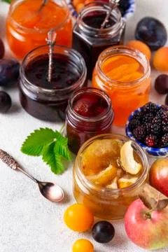 Assortment of different jams in jars Stock Photos