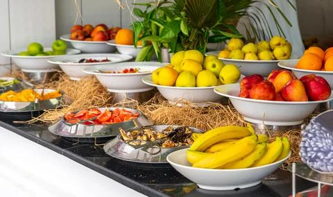 Assortment of different kind of fresh apples on the table in buffet line with Stock Photos