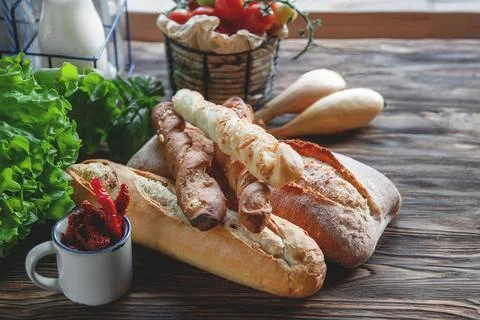 An assortment of different types of bread. Italian ciabatta bread, grissini w Stock Photos