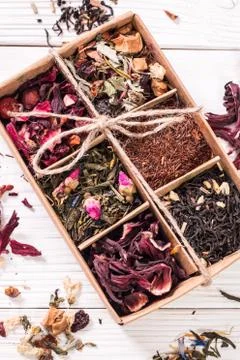Assortment of dry tea on a wooden table,healthy drink Stock Photos