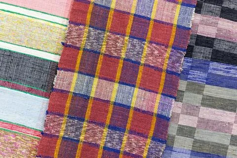 Assortment of fabrics with checkered patterns, colorful background Stock Photos