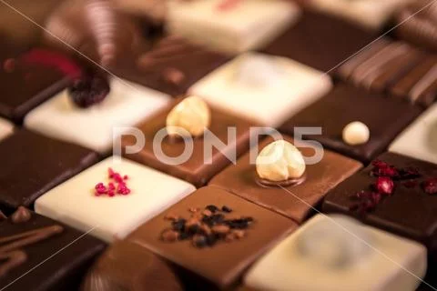 Assortment of fine chocolate candies, white, dark and milk chocolate Stock Photos
