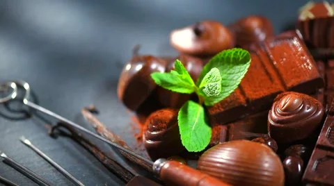Assortment of fine chocolates in dark and milk chocolate with vanilla and mint Stock Footage 50048392