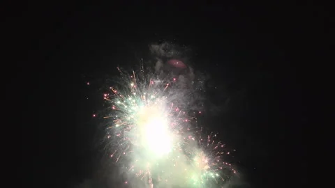 Assortment of fireworks exploding in night sky 4k Video stock 342777719