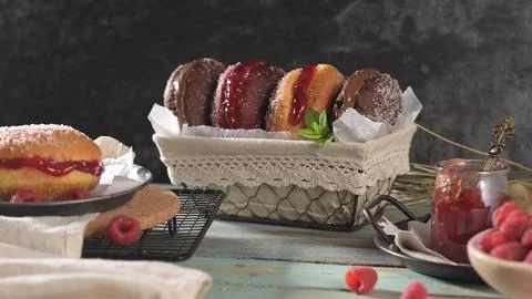 Assortment of Fresh Filled Donuts with Raspberry Jam and Chocolate in a Wir.. Stock Photos