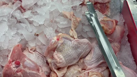 Assortment of fresh raw chicken meat parts displayed at market 库存影片 340485795