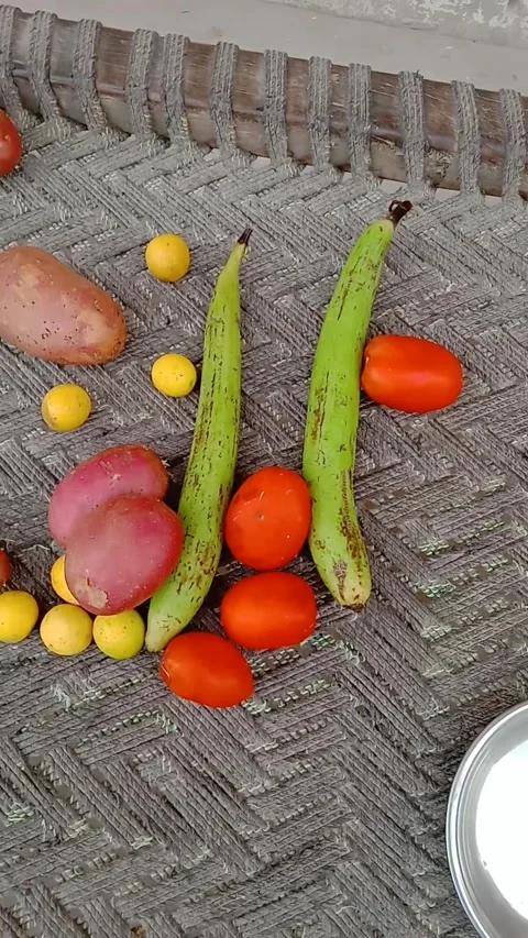 Assortment of Fresh Vegetables with Potato, Sponge Gourd, Tomato, and Lemon Stock Footage 331899839