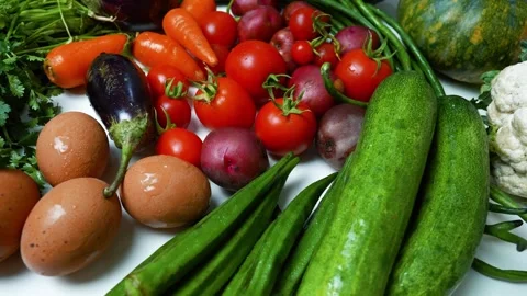 Assortment of Fresh Vegetables on White Surface, A colorful assortment of f.. Vídeo Stock 305032143