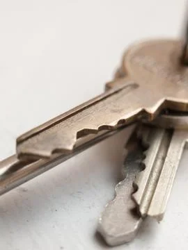 Assortment of keys on white background Stock Photos