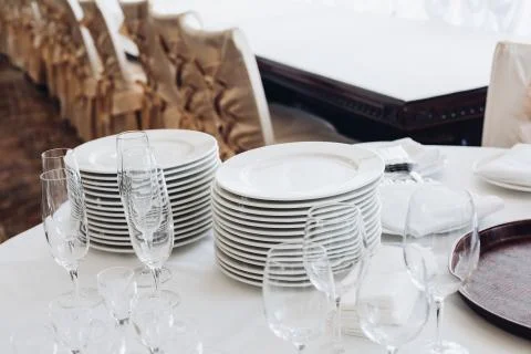 Assortment of kitchenware on white table.View over white round table with stacks 写真素材