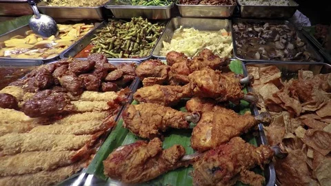 Assortment of Meats and Vegetables at a Buffet in Singapore Stockbeeldmateriaal 72920968