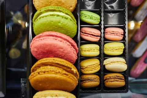 Assortment of multicolored macaroon different lie in the cardboard box with the Stock Photos