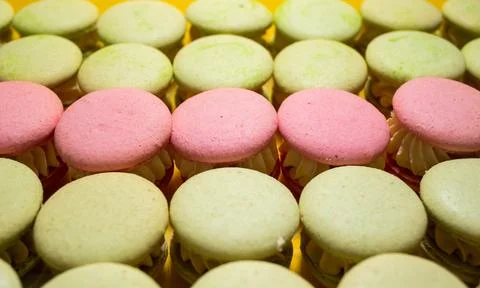 Assortment of multicolored macaroon different lie in the cardboard box with t Stock Photos